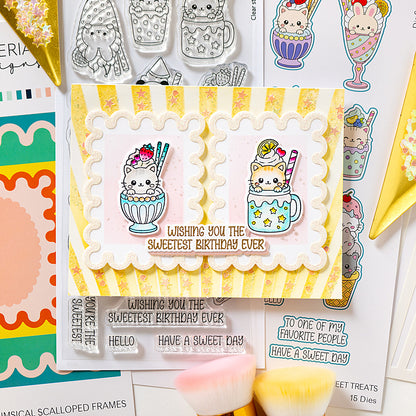 A handmade greeting card featuring two cute cartoon cats in milk tea sunda cups, with the text 'Wishing you the SWEETEST birthday ever' in brown script. The card is styled on a flat-lay of craft supplies, including other cards, stickers, and small brushes. Sweet treats alex syberia designs stamp
