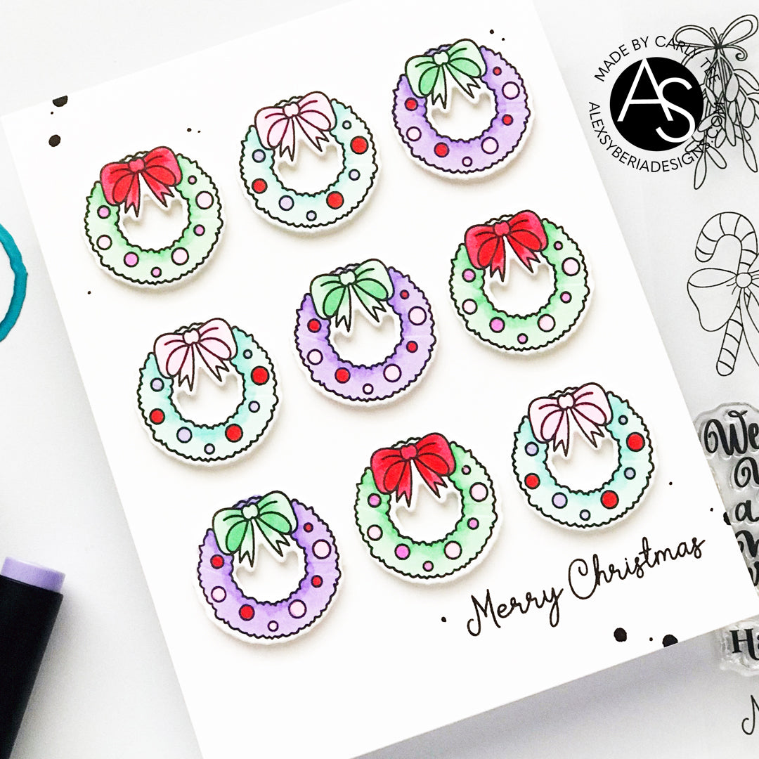 Colorful Christmas wreath stickers with bows on a white card with 'Merry Christmas' text.